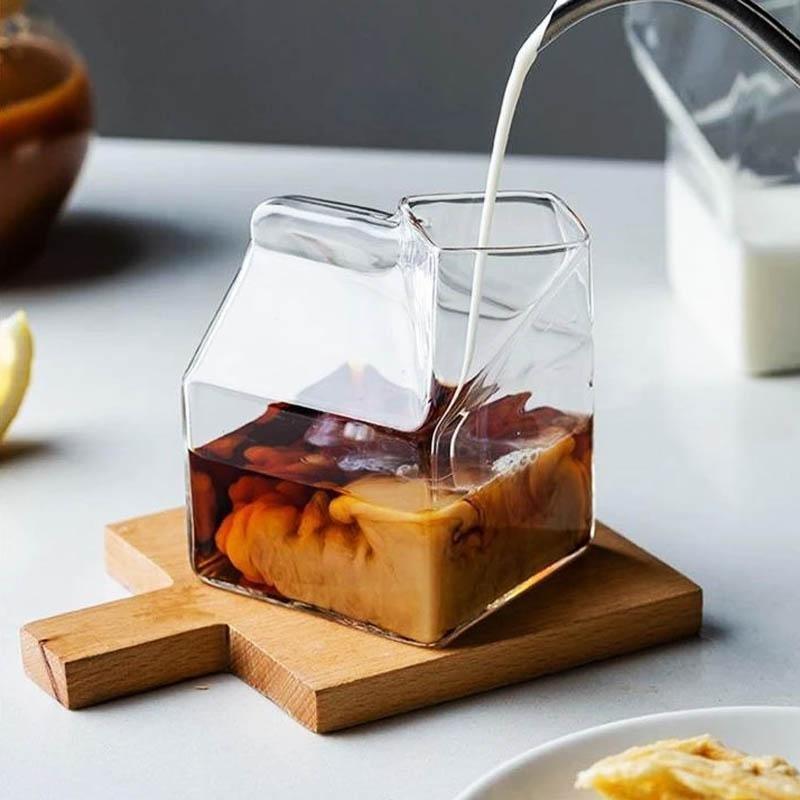 Premium Transparent Glass Milk Carton on a table with beverages