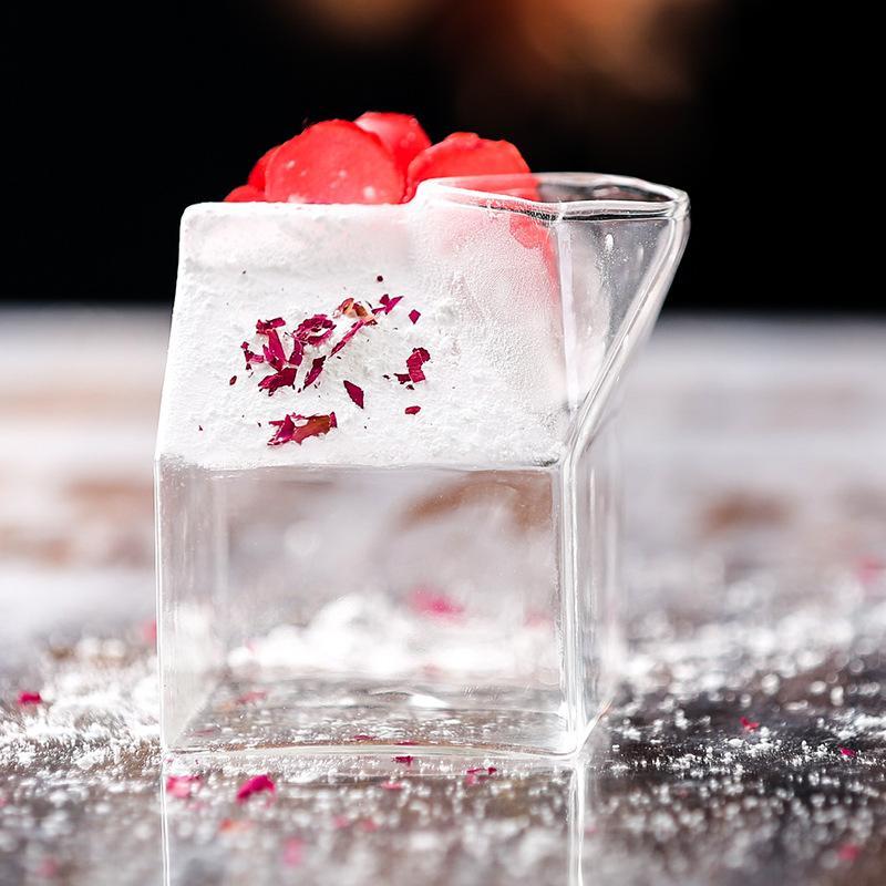 Premium Transparent Glass Milk Carton on a table with beverages