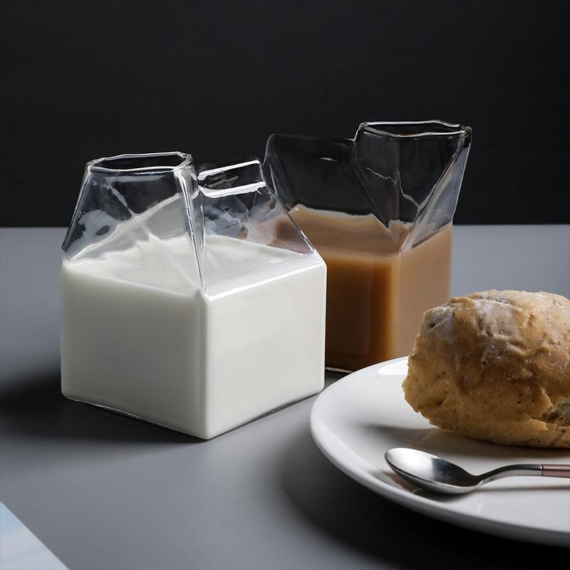 Premium Transparent Glass Milk Carton on a table with beverages