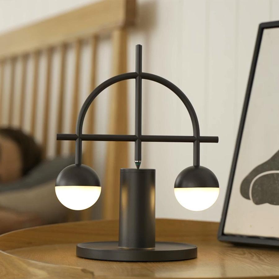 Libra Heng Balance Lamp showcasing a unique balance mechanism and modern design on LuxusHeim