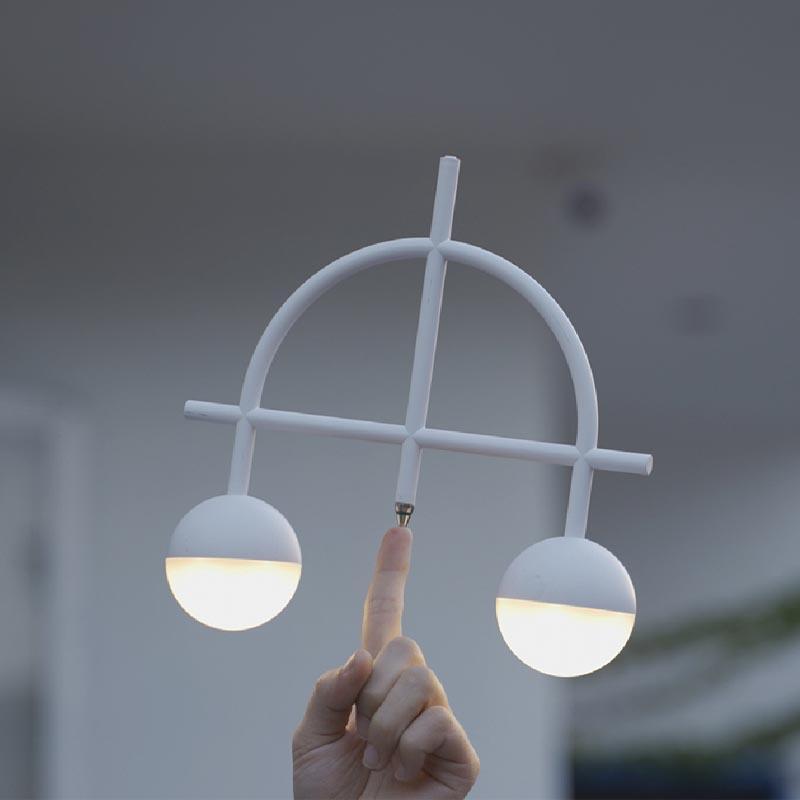 Libra Heng Balance Lamp showcasing a unique balance mechanism and modern design on LuxusHeim