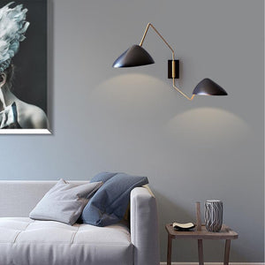 Two Arms Duckbill Wall Lamp with adjustable swing arm and asymmetrical shade in a modern living room setting.